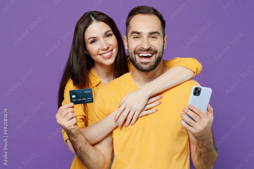 Young happy couple two friends family man woman together in yellow