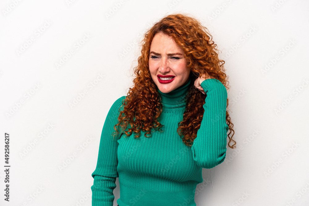 Young ginger caucasian woman isolated on white background covering ears with hands. Young ginger caucasian woman isolated on white background covering ears with hands.