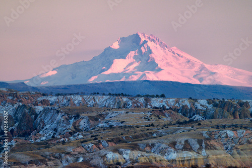 Mount Erciyes. Snow covered volcanic 3916m peak.  Highest mountain in central Anatolia Turkey. S.E. over gorges of Goreme photo