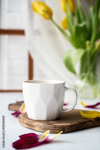 white mug on the kitchen table, festive breakfast