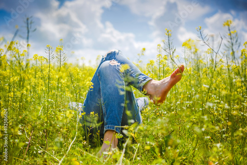 Fototapeta Naklejka Na Ścianę i Meble -  Relax in the field, yellow flowers and sunny summer time