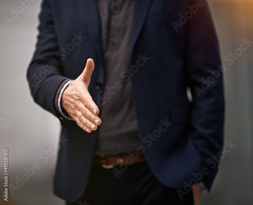 Trust is the first step to success. Cropped shot of a businessman extending his arm for a handshake.