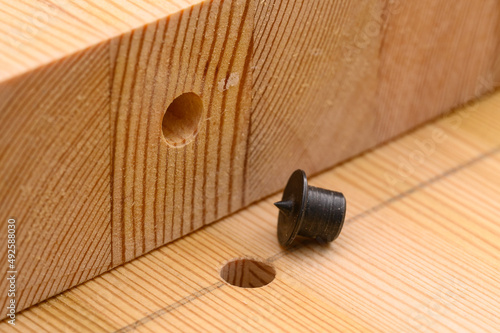 Marking of the hole in the furniture panel. Transfer the center of the hole for an exact match using a spike.