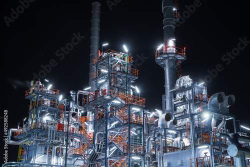 Night scene of oil refinery plant and power plant of petrochemical industry photo