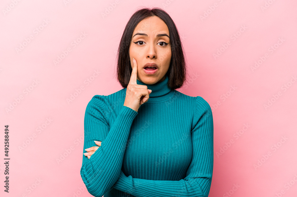 Young hispanic woman isolated on pink background having some great idea, concept of creativity. Young hispanic woman isolated on pink background having some great idea, concept of creativity.