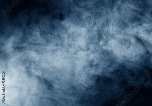 Smoke over black background. Fog or steam texture.