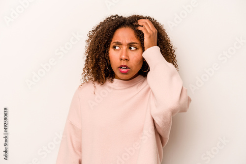 Young African American woman isolated on white background being shocked, she has remembered important meeting. © Asier