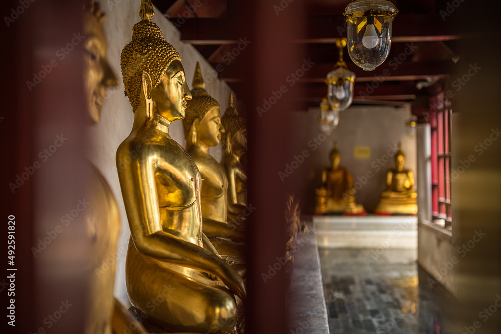 Old Beautiful Golden Buddha Many statues at Wat Phra Si Rattana Mahathat also colloquially referred to as Wat Yai is a Buddhist temple It is a major tourist is Public places in Phitsanulok,Thailand. Old Beautiful Golden Buddha Many statues at Wat Phra Si Rattana Mahathat also colloquially referred to as Wat Yai is a Buddhist temple It is a major tourist is Public places in Phitsanulok,Thailand.