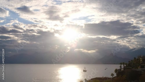 Port in Old City of Antalya or Kaleici in Turkey. Tourist ship arranges a tour at sunset time. winyer travel to Turkey photo