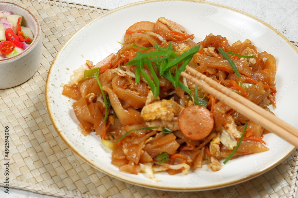 kwetiaw goreng or called Char Kwe Teow.Popular in Indonesia, Malaysia and Singapore kwetiaw goreng or called Char Kwe Teow.Popular in Indonesia, Malaysia and Singapore