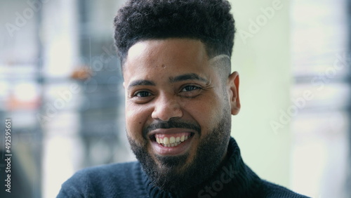 A young Brazilian hispanic latin man portrait smiling at camera