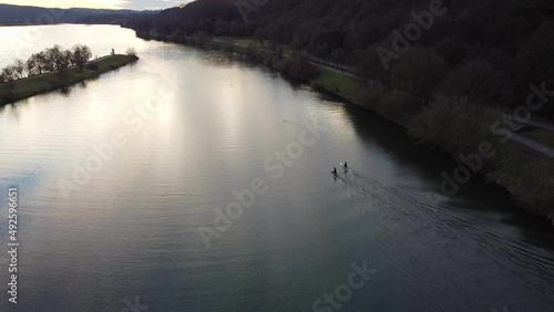 Aerial dron view of lake, water and silhouette of trees during sunset. Evening nature, beautiful landscape. FullHD footage