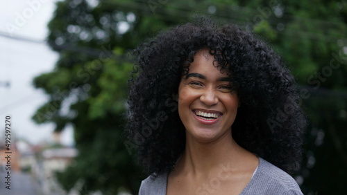 Young woman laughing and smiling happy person