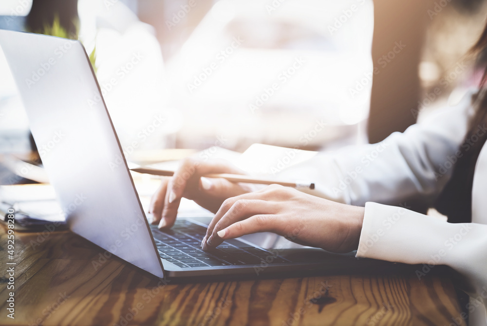 Fototapeta premium Young economists or accountants or financiers and investors are reviewing budget documents and using computers to study impact and risk assessments on corporate investment management.