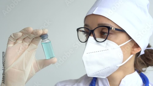 Infectious doctor show COVID 19 vaccine for prevention, immunization and treatment for new corona virus infection. Medical technology concept