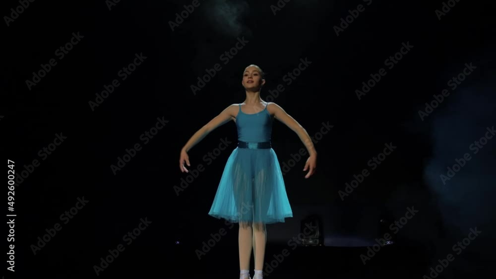 A girl performs an attitude in a ballet school A girl performs an attitude in a ballet school