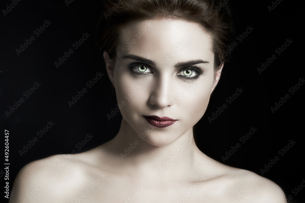 Vampire Goth. A fiery gothic girl posing on a black background. Vampire Goth. A fiery gothic girl posing on a black background.