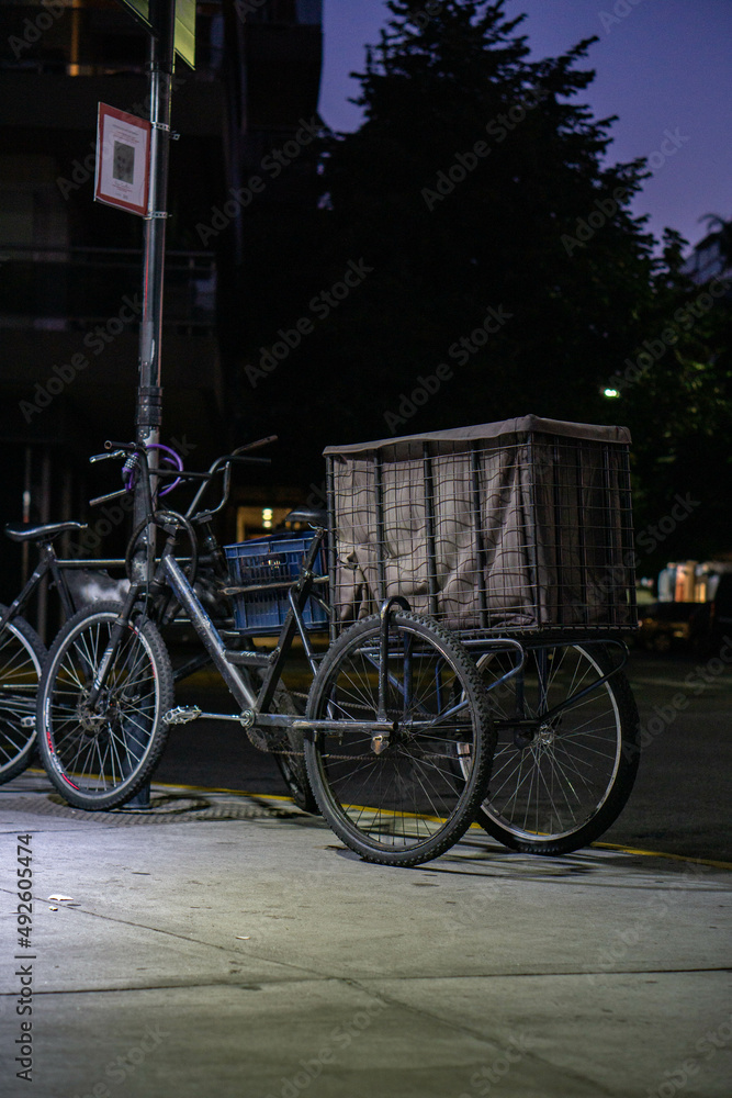 Old fashion bike parked under a street light