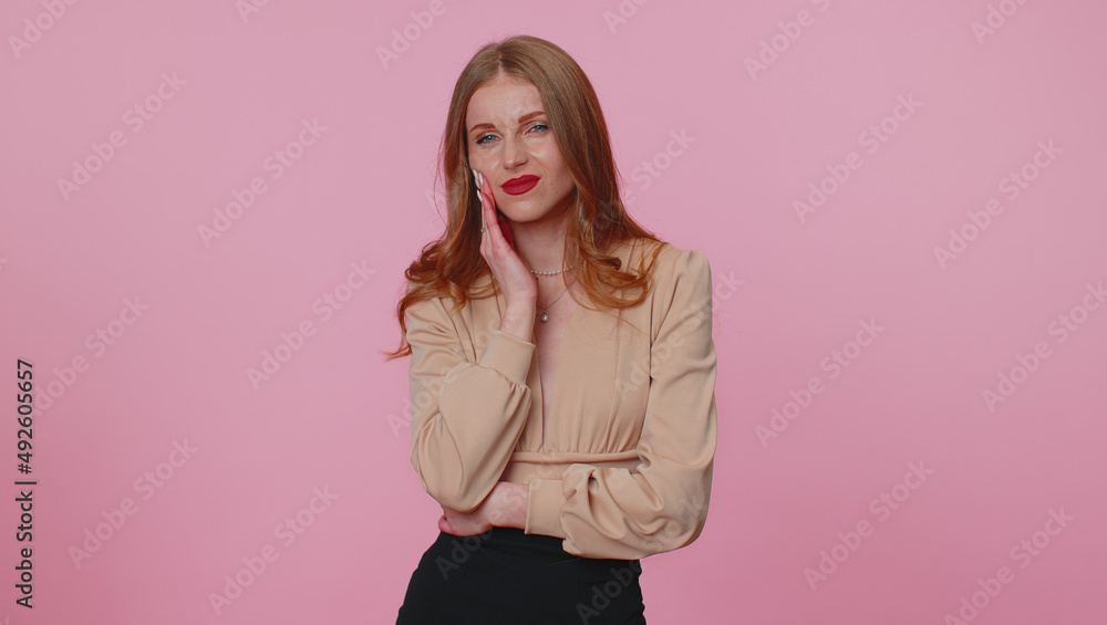 Dental problems. Businesswoman girl touching cheek, closing eyes with expression of terrible suffer from terrible toothache, sensitive teeth, cavities. Young woman isolated on pink studio background Dental problems. Businesswoman girl touching cheek, closing eyes with expression of terrible suffer from terrible toothache, sensitive teeth, cavities. Young woman isolated on pink studio background