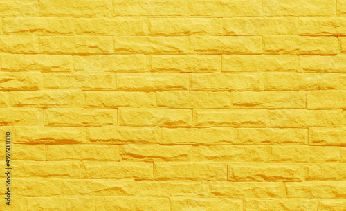 Foto Golden yellow brick wall texture with vintage style pattern for background and design art work