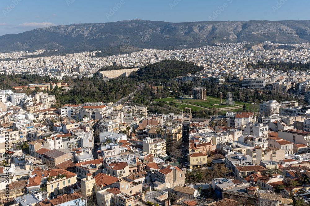 Athens Greek capital seen from above. Bird's eye view from Acropolis over the city with white houses, towers.