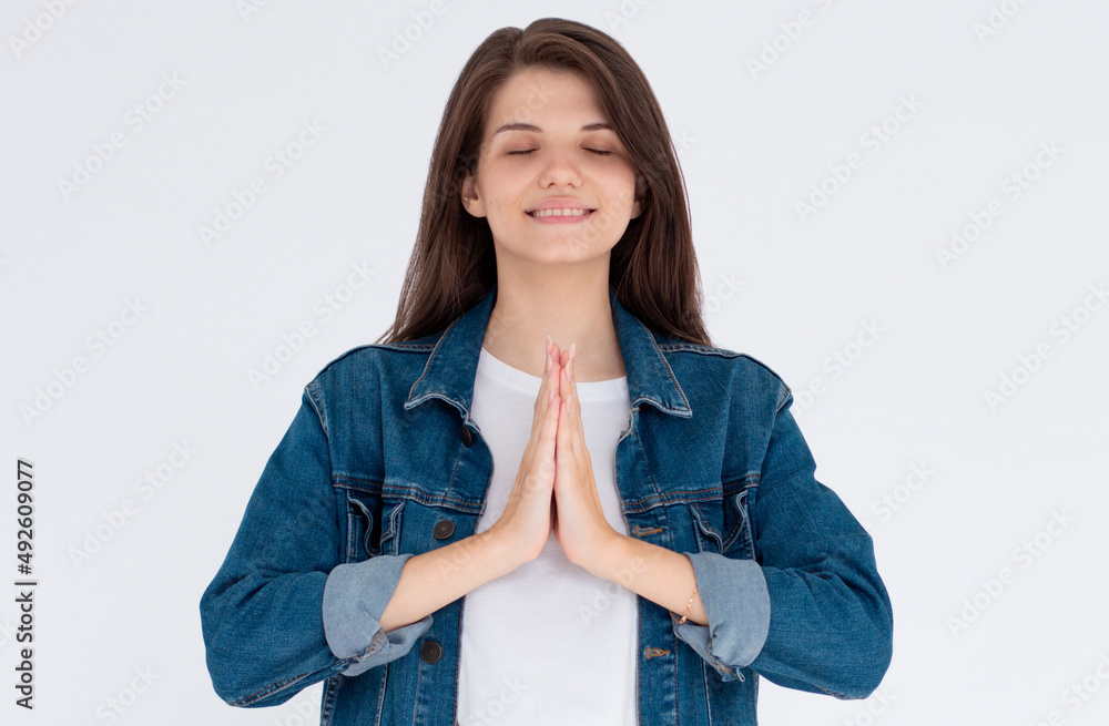 Smiling attractive charming caucasian woman holding palms together pray, smiling friendly showing namaste welcome gesture, inviting asian guests come in Smiling attractive charming caucasian woman holding palms together pray, smiling friendly showing namaste welcome gesture, inviting asian guests come in