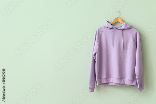 Stylish lilac hoodie hangin...