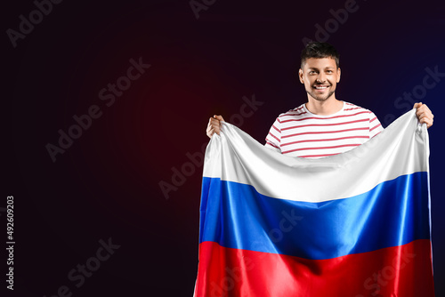 Handsome man with flag of R...