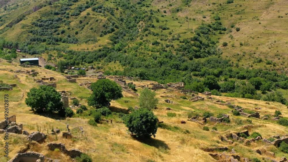 Aerial view over ruins in the highlands of sunny Armenia - circling, drone shot Aerial view over ruins in the highlands of sunny Armenia - circling, drone shot