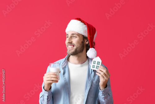 Young man in Santa hat with...