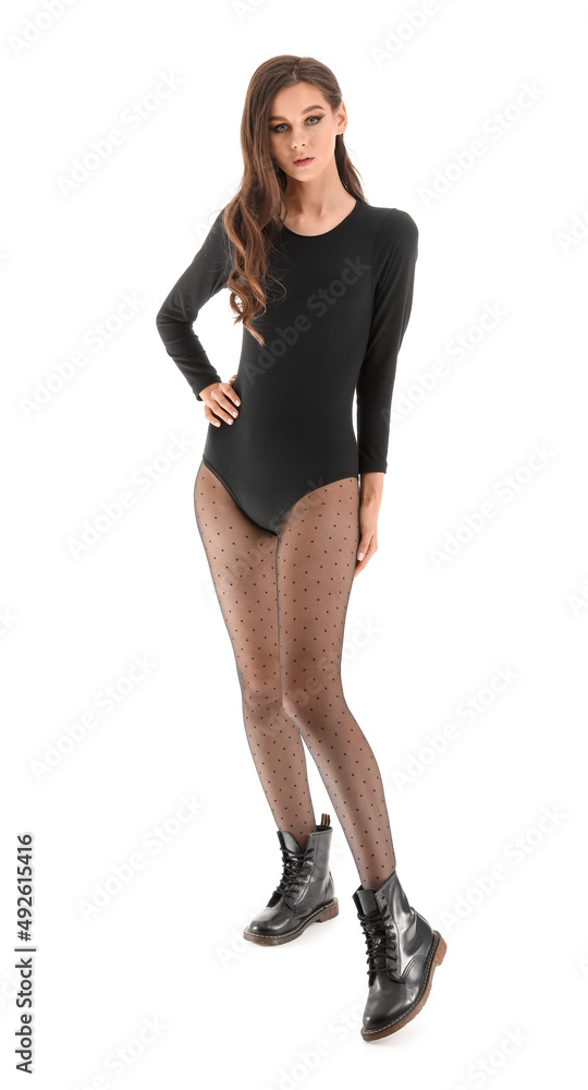 Fototapeta premium Fashionable young woman in black tights isolated on white