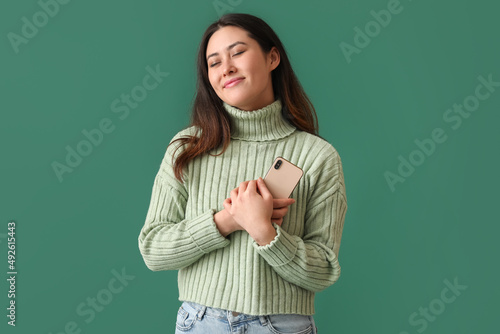 Happy young Asian woman wit...