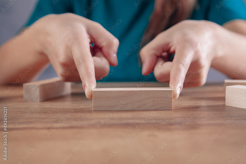 young woman holding wooden rectangles young woman holding wooden rectangles
