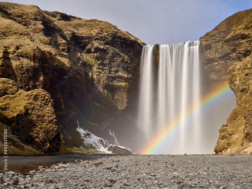 View of Skogafoss Waterfall with the rainbow in winter time, Iceland. Stock Photo | Adobe Stock