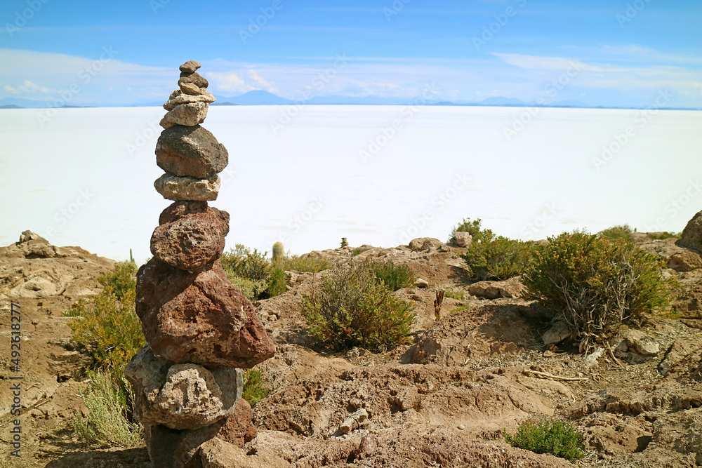 Stone Stack on Isla Incahuasi or Isla del Pescado Rocky Outcrop against Uyuni Salt Flats, Potosi, Bolivia, South America Stone Stack on Isla Incahuasi or Isla del Pescado Rocky Outcrop against Uyuni Salt Flats, Potosi, Bolivia, South America