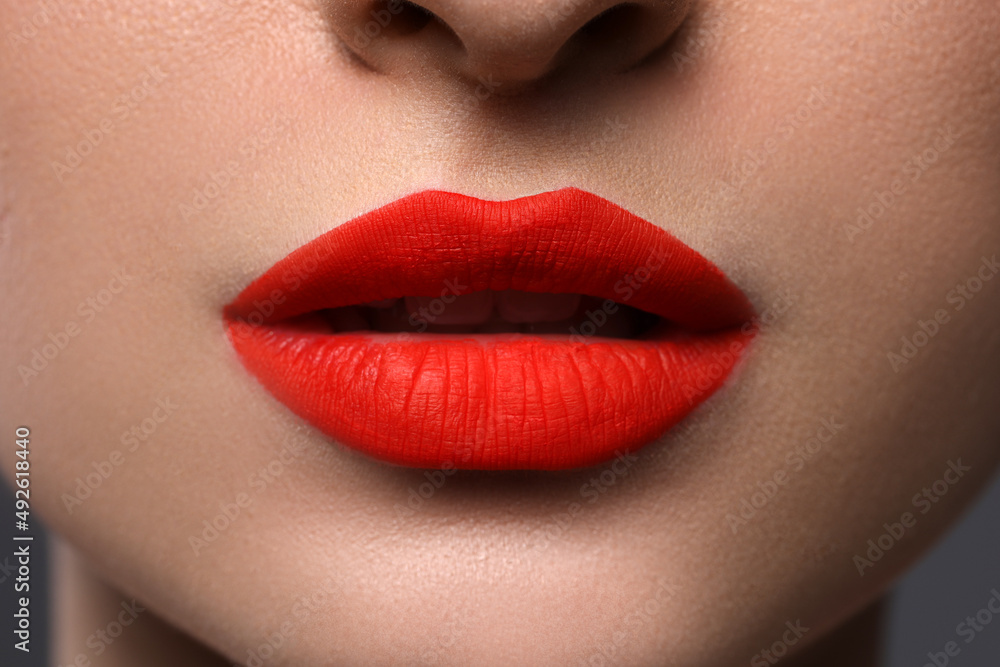 Young woman with beautiful red lips, closeup Young woman with beautiful red lips, closeup