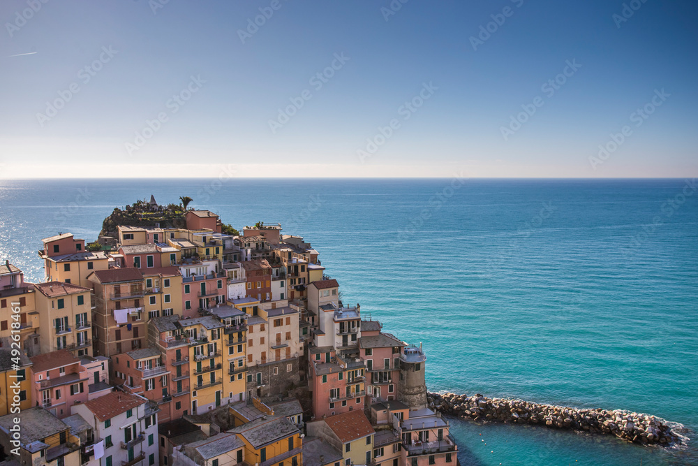 View of Manarola, a beautiful town along the coast of Cinque Terre with colourful buildings, Liguria, Italy. View of Manarola, a beautiful town along the coast of Cinque Terre with colourful buildings, Liguria, Italy.