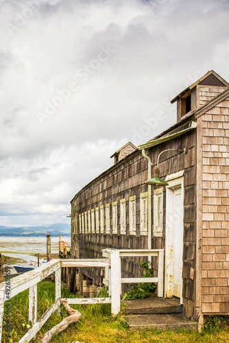 An old shingle seafood building on the edge of water