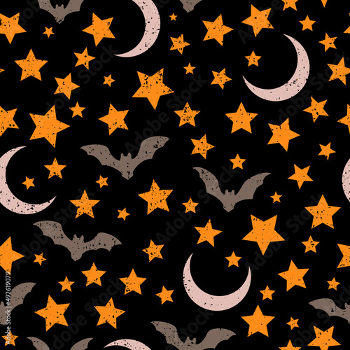 seamless pattern of soaring bats and stars on a black background
