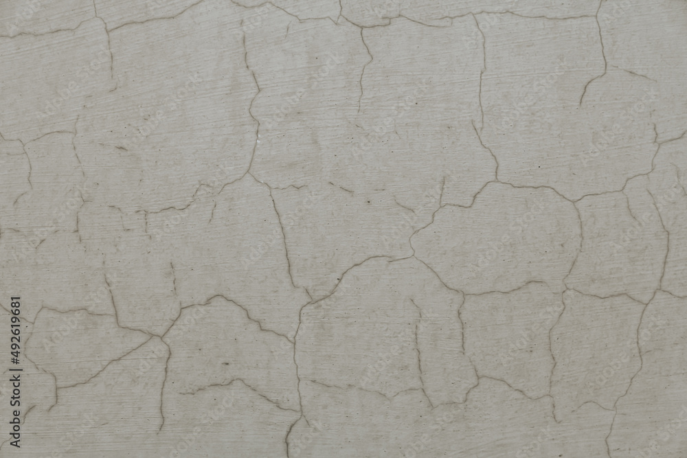 Abstract background, old cement wall. A concrete wall texture with cracks and scratches. Abstract background, old cement wall. A concrete wall texture with cracks and scratches.