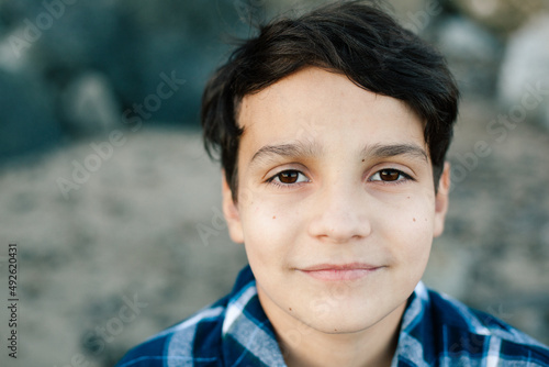 Portrait Of A Tween Boy With Brown Eyes photo