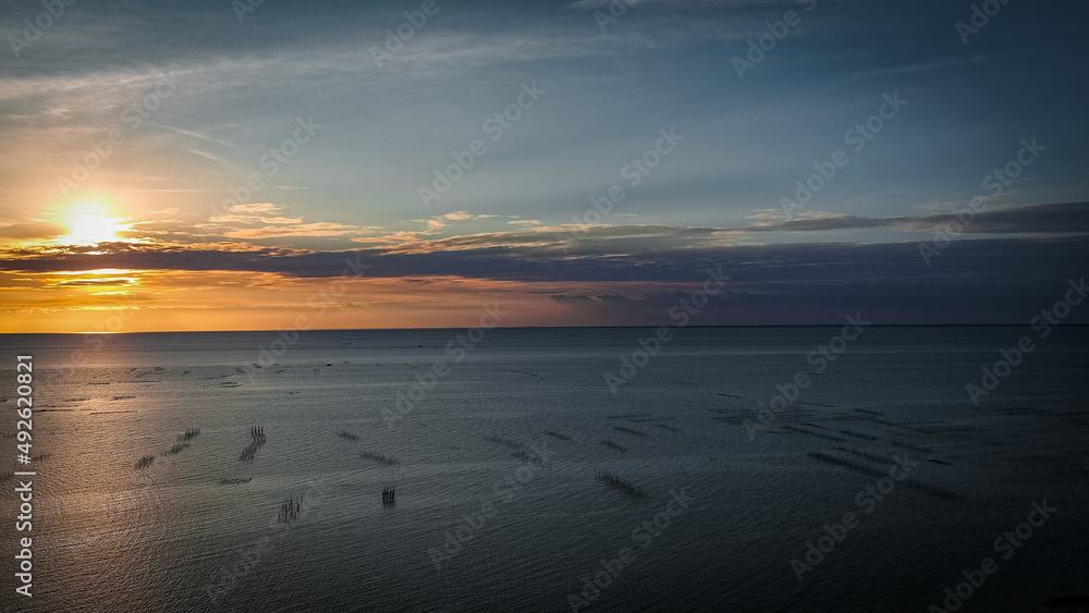 sunset at the beach by drone