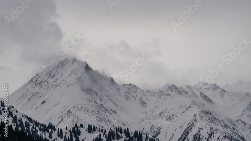 Fog and bad weather in snowy mountains © Daniil_98_03_09