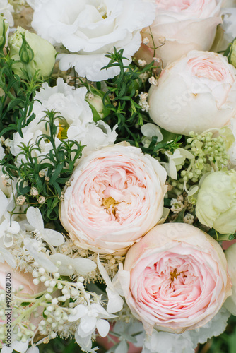 Pale pink peony-shaped roses and white eustoma close-up in a bouquet for the bride for the wedding