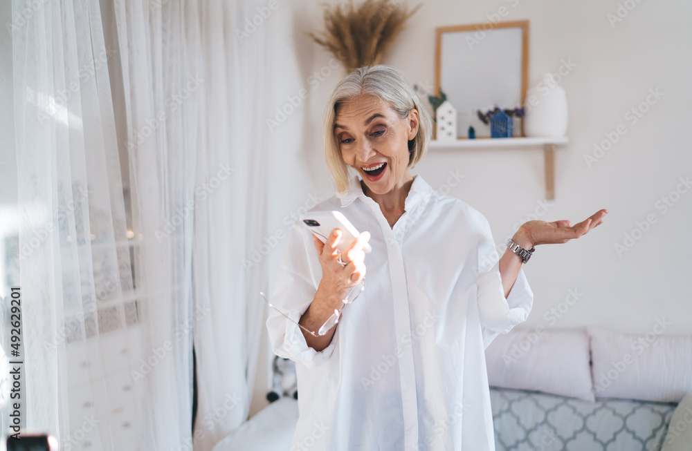 Senior caucasian woman using smartphone at home Senior caucasian woman using smartphone at home
