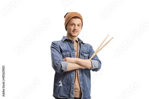 Guy musician holding drumsticks photo