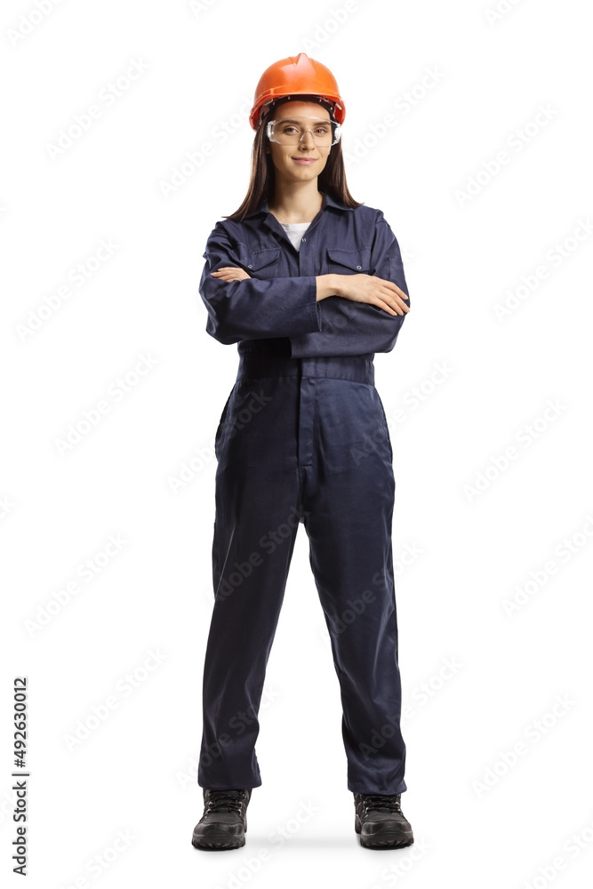 Female worker in a uniform with a helmet and goggles posing Female worker in a uniform with a helmet and goggles posing