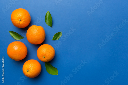 fresh Fruit orange slices on colored background. Top view. Copy Space. creative summer concept. Half of citrus in minimal flat lay with copy space © sosiukin