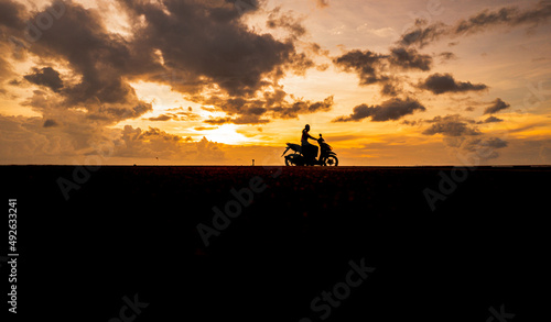 Silhouette on a motorcycle at sunset