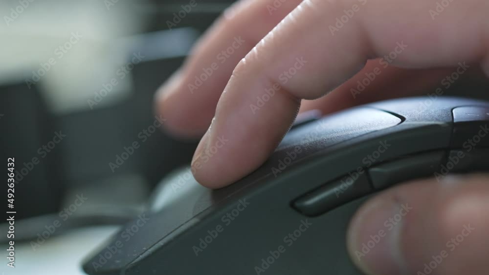 Close up, macho shot of pc, computer mouse and hand. Pushing mouse buttons. Close up, macho shot of pc, computer mouse and hand. Pushing mouse buttons.